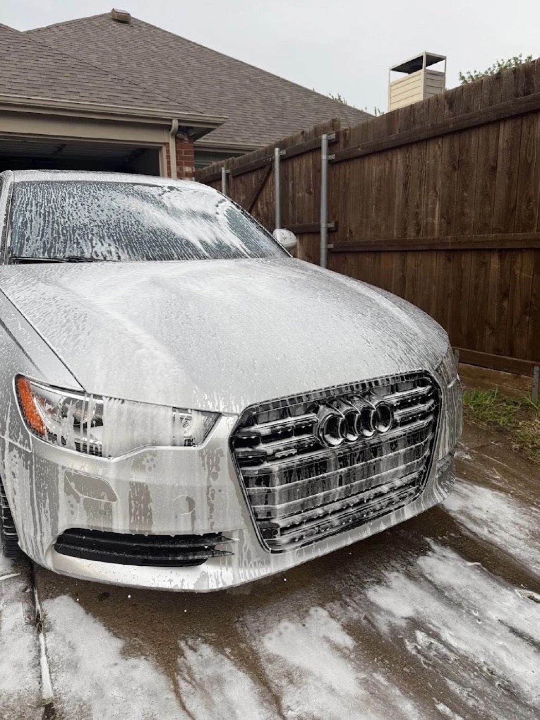 Foam pre-wash on an Audi during a mobile detail in Plano